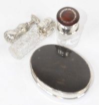 Two silver lidded glass dressing table jars, the largest h.7cm; together with a white metal seal;