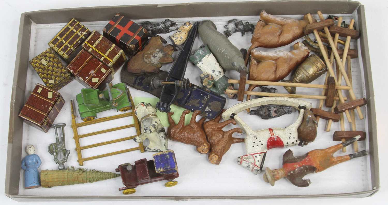 A collection of vintage models, to include lead painted figures and tinplate model luggage