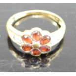A Victorian style 18ct gold garnet set flower head cluster ring, 3.1g, size N