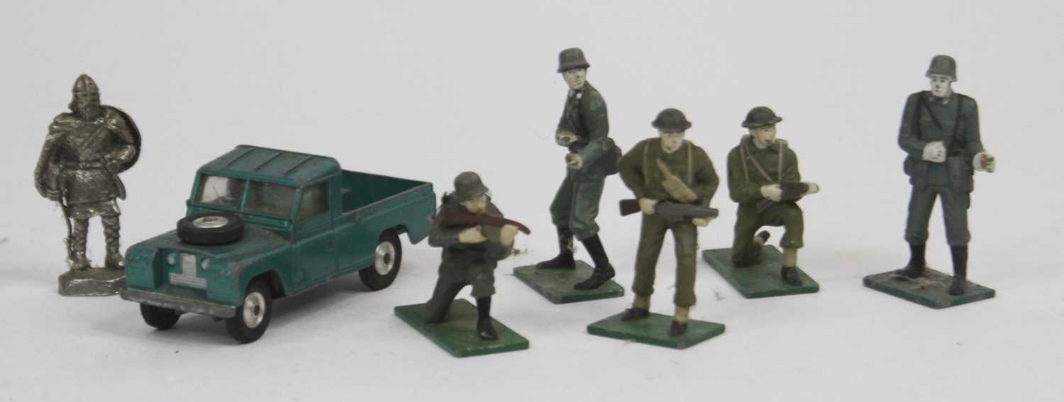 A vintage Corgi model diecast Landrover together with a collection of lead painted army figures