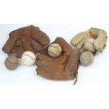 A collection of vintage baseball balls and gloves