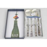 A Chinese white metal spoon and chopstick set, stamped 800, boxed