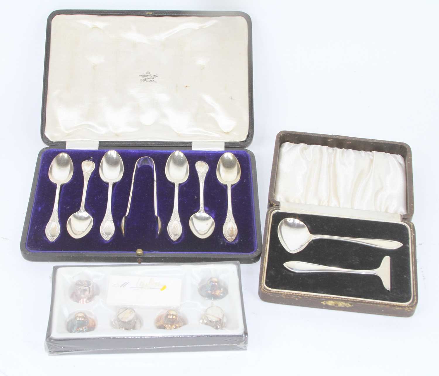 A set of six silver teaspoons and sugar nips, Sheffield 1909, cased; together with a silver two-