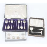 A set of six silver teaspoons and sugar nips, Sheffield 1909, cased; together with a silver two-