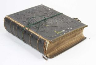 A Victorian family bible, bound in tooled black leather