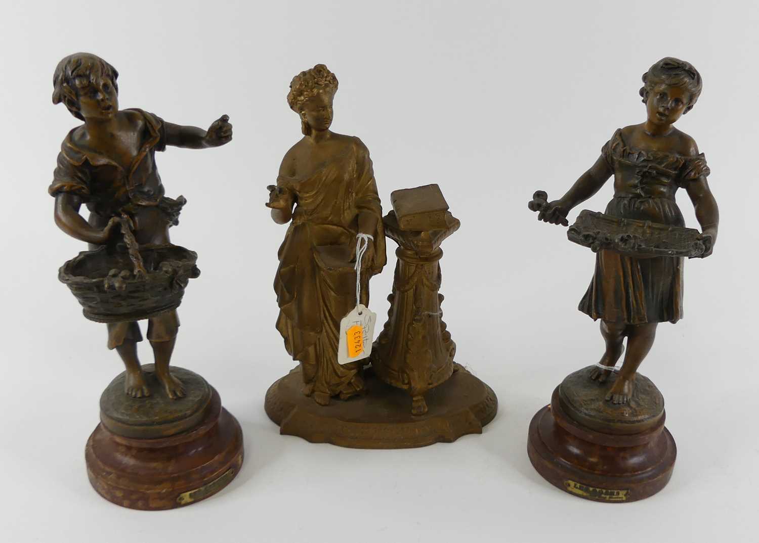 After Moreau, a pair of early 20th century spelter figures of flower sellers, the boy & girl each