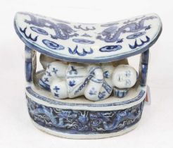 A Chinese blue and white pottery pillow, w.18cm