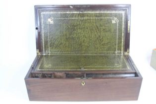 A 19th century mahogany writing slope, of hinged rectangular form, opening to reveal a fitted