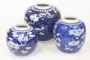 A graduated matched set of three Chinese blue and white prunus vases, the largest h.14cm Lacking