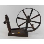 A vintage oak spinning wheel, h.35cm