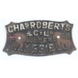 A cast iron sign inscribed Chas Roberts & Co. Ltd., Builders, Wakefield, 1963, width 29cm