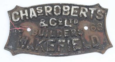 A cast iron sign inscribed Chas Roberts & Co. Ltd., Builders, Wakefield, 1963, width 29cm