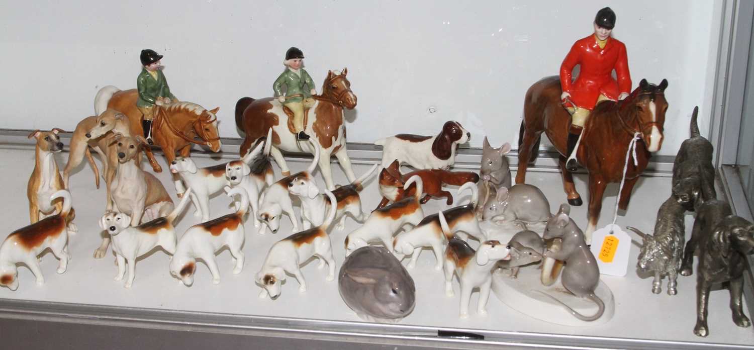 A collection of Beswick models of hunting hounds, together with Beswick models of horses and
