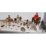 A collection of Beswick models of hunting hounds, together with Beswick models of horses and