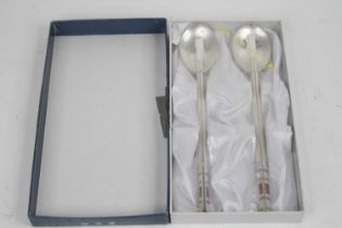 A Chinese white metal spoon and chopstick set, stamped 800, boxed