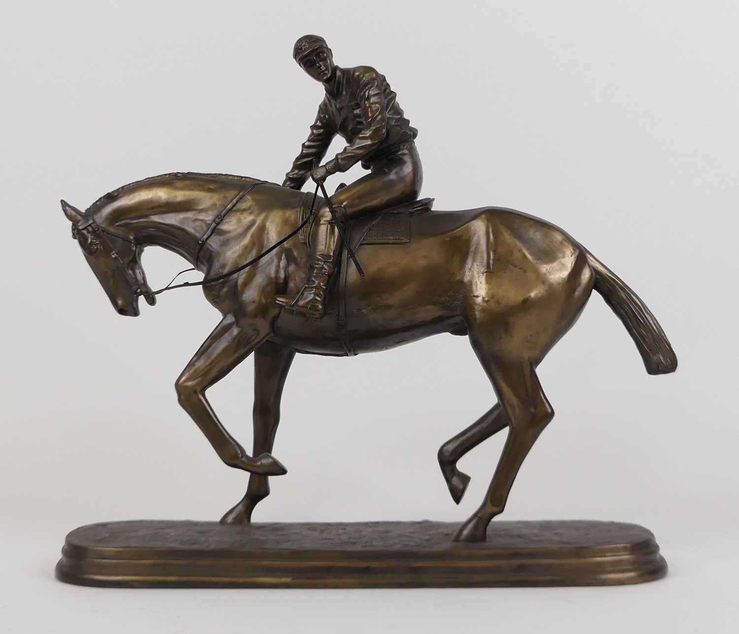 A bronzed figure of a horse and jockey, height 32cm