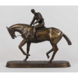 A bronzed figure of a horse and jockey, height 32cm