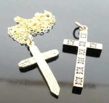A modern 9ct gold cross pendant on finelink neck chain; together with a 9ct gold and cz set cross