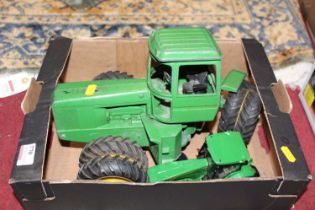 An ERTL 1/16 scale articulated 4WD John Deere tractor, together with one other