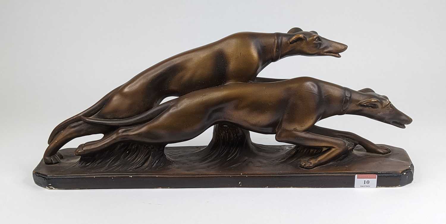An Art Deco gilt plaster model of two greyhounds racing, width 58cm