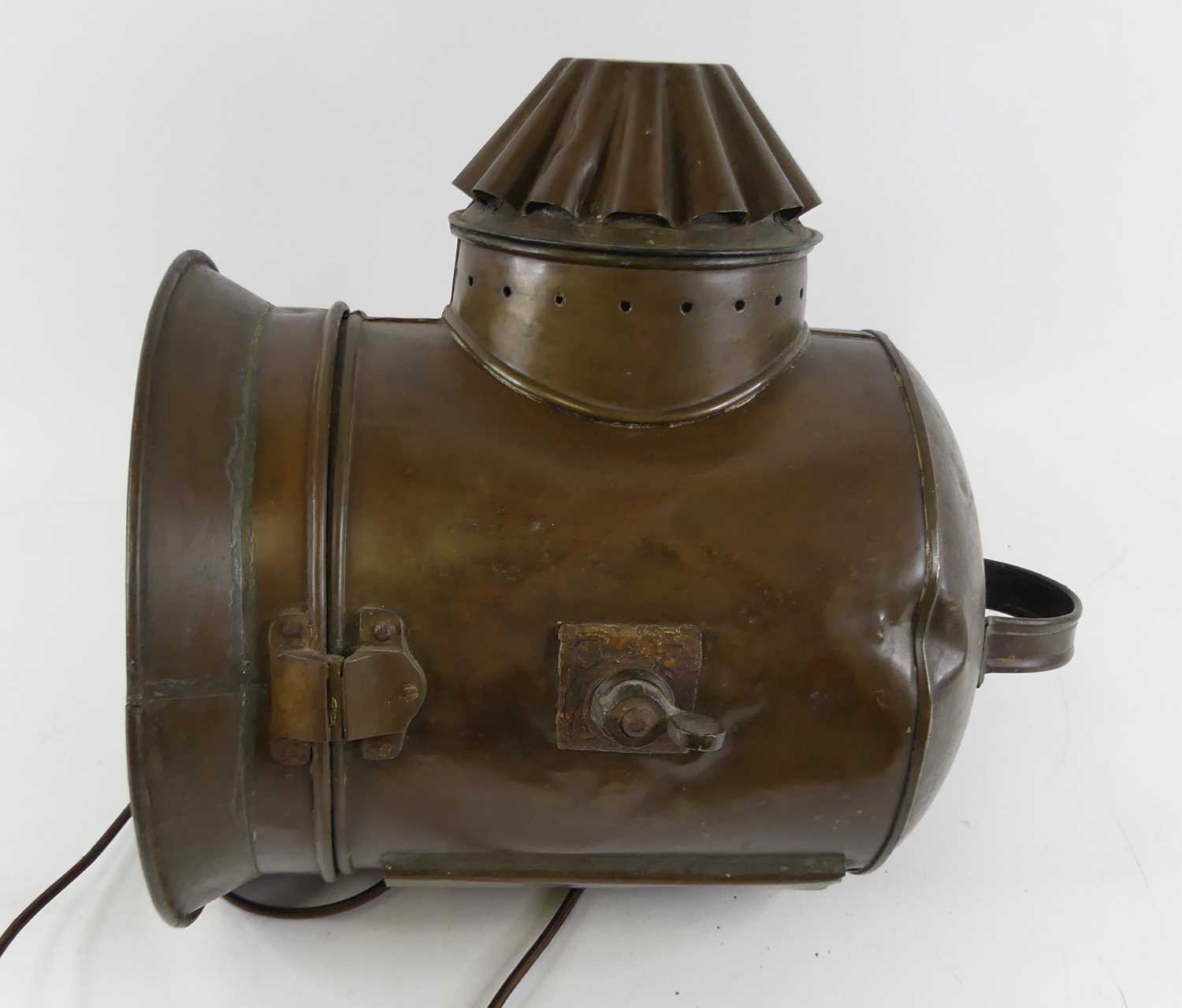 An early 20th century copper ship's spotlight, bearing a label for Yarmouth Stores, Ship Lamp - Image 2 of 2