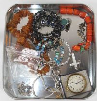 A collection of costume jewellery to include beaded necklaces and bracelets, and a Zenith pocket