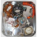 A collection of costume jewellery to include beaded necklaces and bracelets, and a Zenith pocket