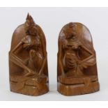 A pair of Asian carved hardwood figural bookends, each height 30cm