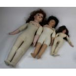 A Bruj bisque headed doll; together with two other similar (3)