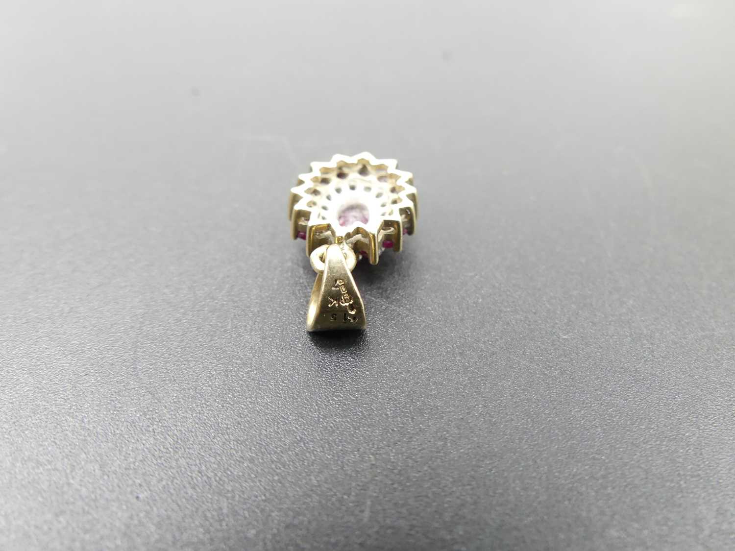 A modern 9ct gold, ruby and diamond point set flower head pendant, 2.2g, 14 x 10mm (excluding bale) - Image 2 of 2