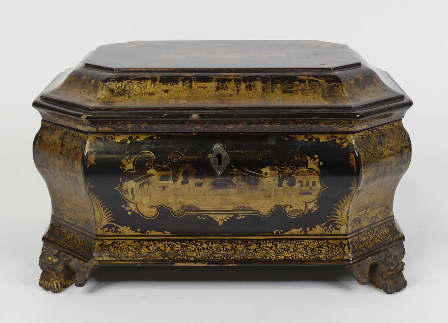 A 19th century Chinese gilt and black lacquer twin compartment tea caddy, of ogee shape, standing