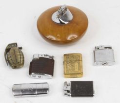 A collection of vintage pocket and table lighters