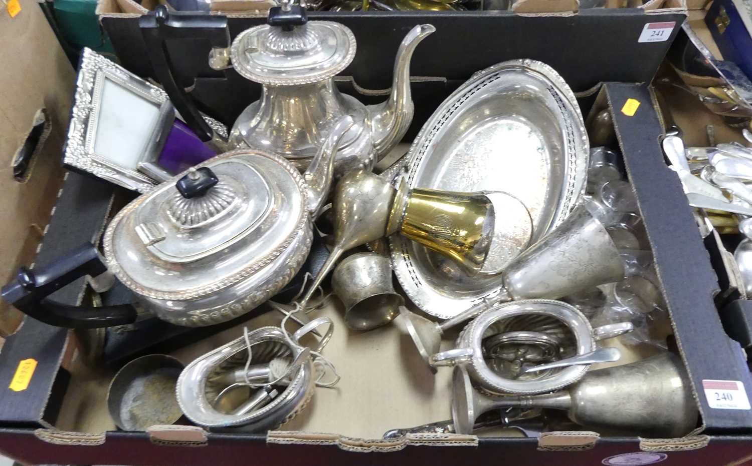 A collection of silver plated items to include matched tea and coffee pots, photograph frames,