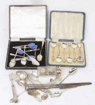 A part set of five George V silver and enamelled coffee bean spoons, cased; together with various
