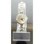 A lady's Helvetia 9ct gold cased manual wind wristwatch, on rolled gold bracelet, case dia.18mm