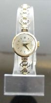 A lady's Helvetia 9ct gold cased manual wind wristwatch, on rolled gold bracelet, case dia.18mm