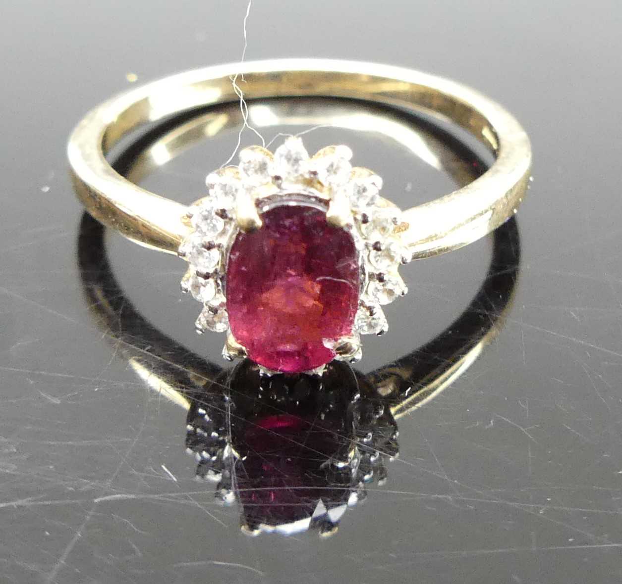 A 9ct gold, garnet and cz set cluster ring, 2.2g, size N
