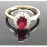 A 9ct gold, garnet and cz set cluster ring, 2.2g, size N