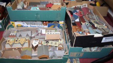 Five trays containing cardboard kit built 00 gauge related stations, and others