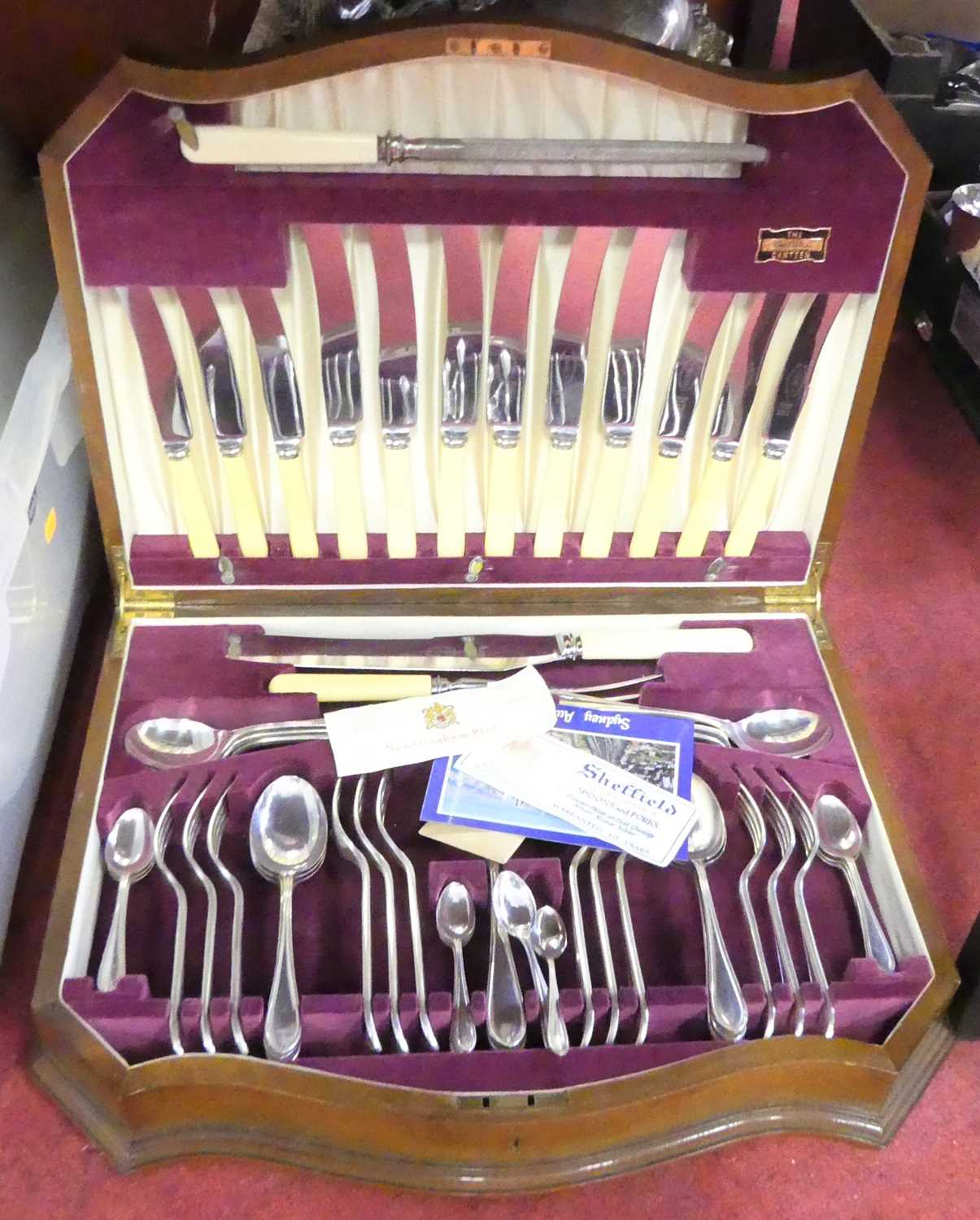 A canteen of silver plated cutlery, a six place settings, in Serpentine walnut case, width 45cm