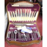 A canteen of silver plated cutlery, a six place settings, in Serpentine walnut case, width 45cm
