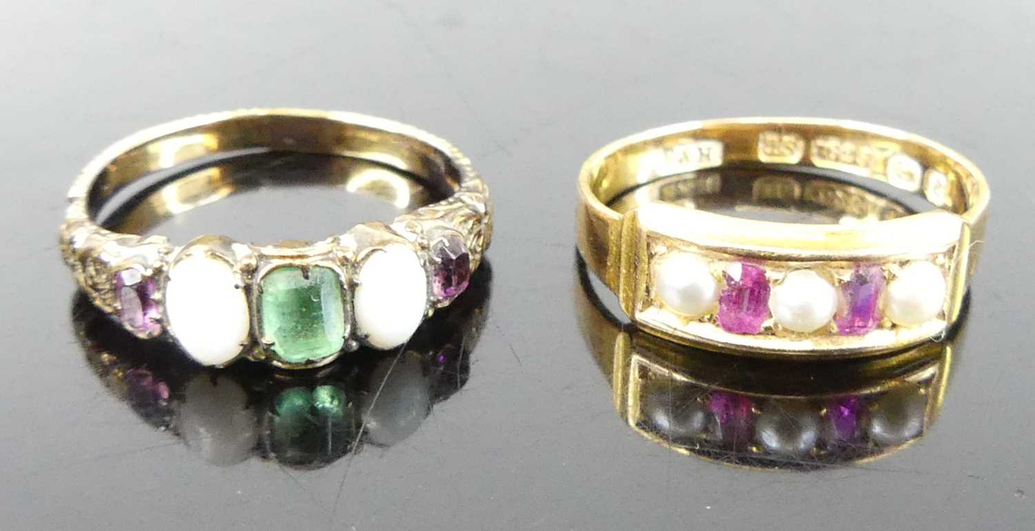 A vintage 15ct gold, ruby and seed pearl set half hoop ring, Birmingham assay, sponsor B&H, size