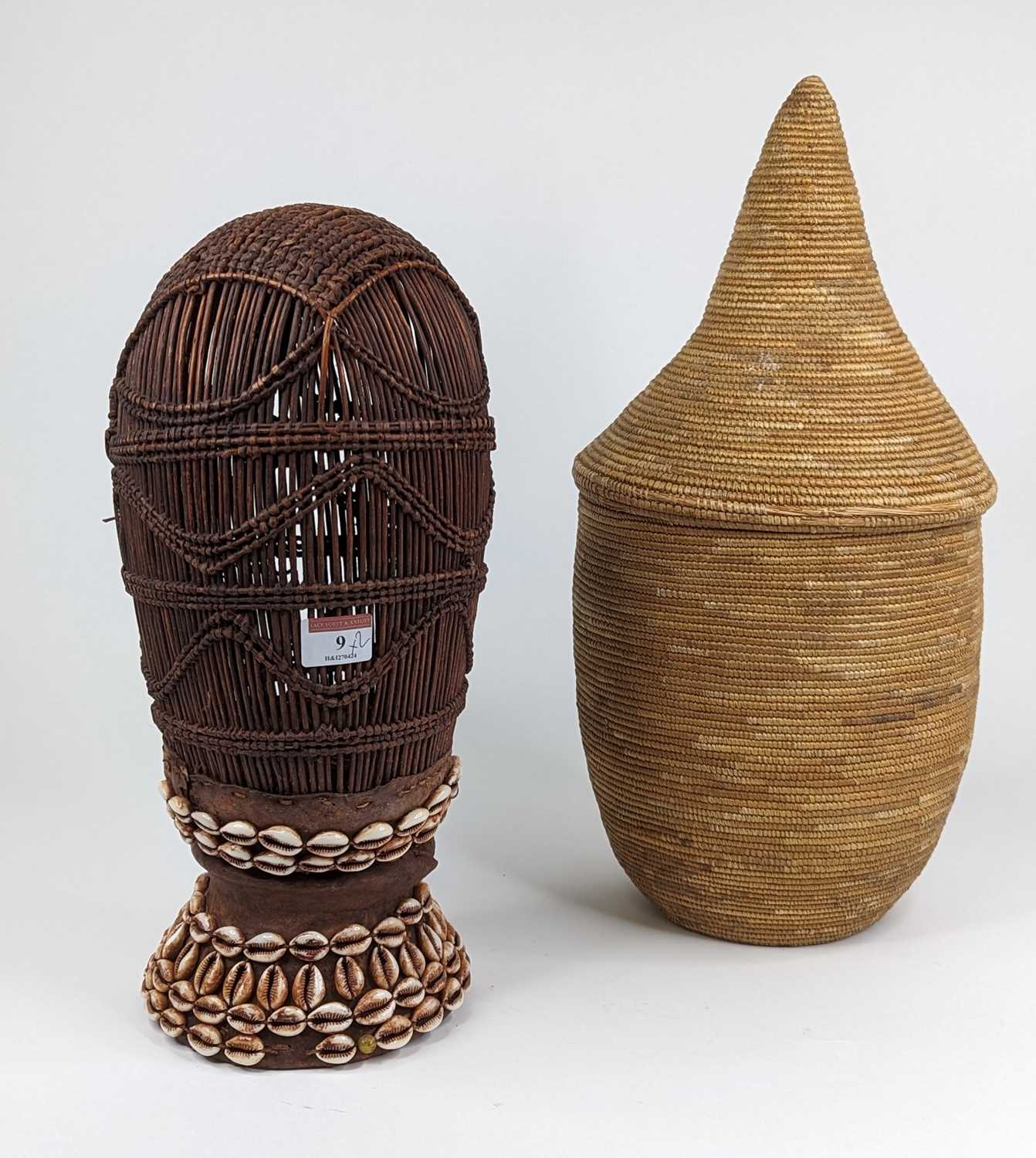 A Somalian wicker food safe, decorated with cowrie shells, height 38cm, together with a Rwandan
