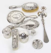 A collection of silver clad dressing table items, to include hand-mirrors, hairbrush, clothes brush,
