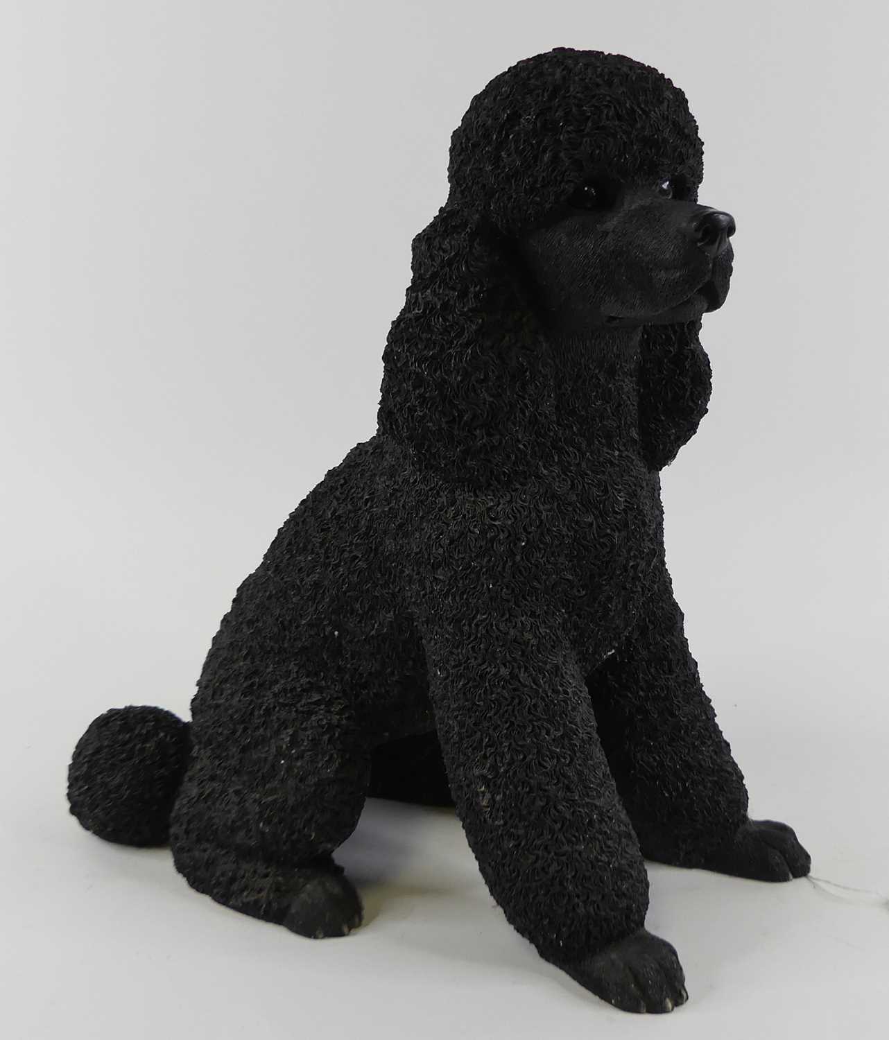 A large Leonardo Collection resin figure of a Poodle in seated pose, height 40cm