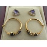 A pair of silver-gilt and trilliant cut tanzanite(?) ear studs, stamped 925, w.9mm; together with