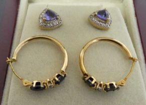 A pair of silver-gilt and trilliant cut tanzanite(?) ear studs, stamped 925, w.9mm; together with