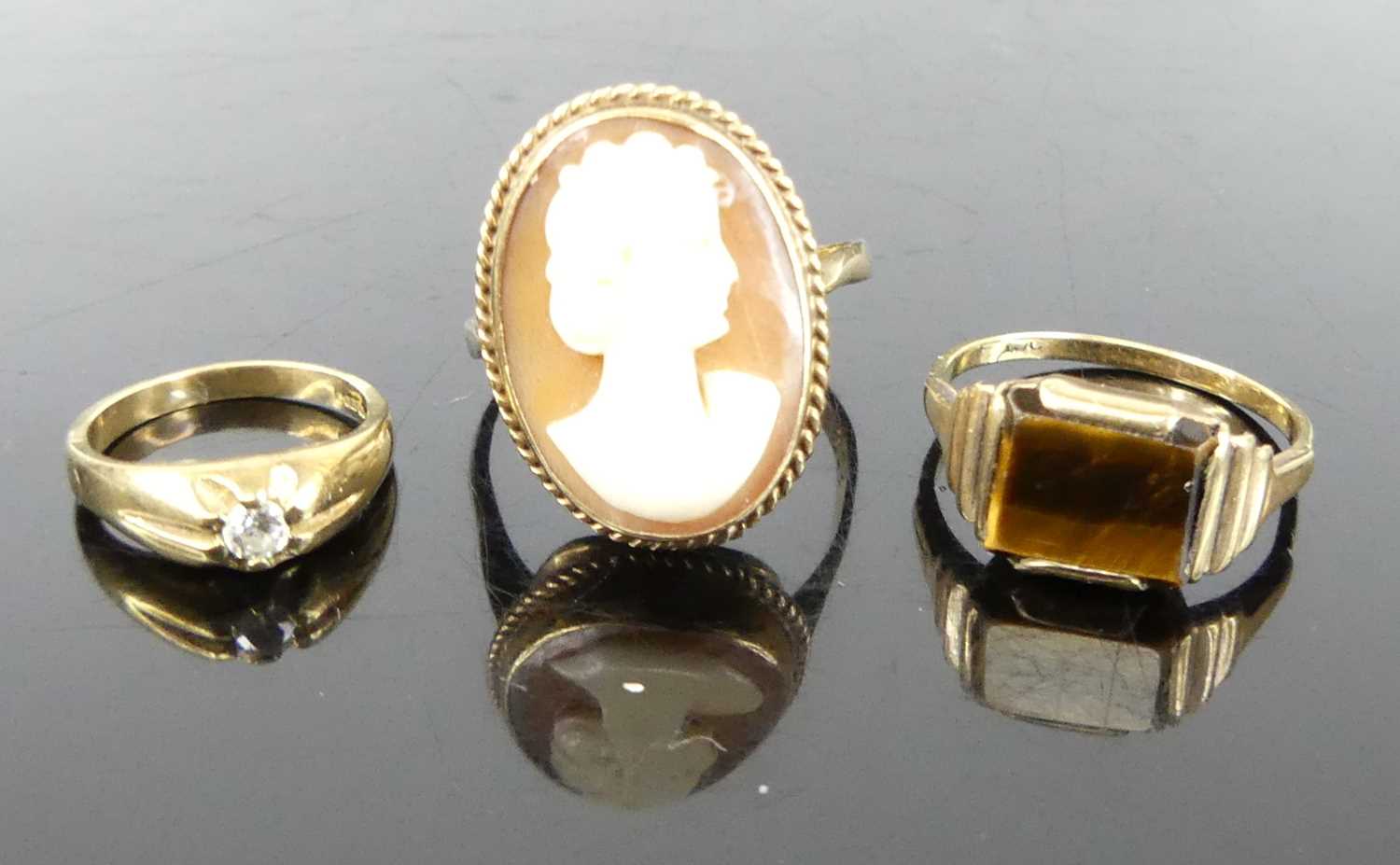 A 9ct gold carved shell cameo dress ring, size M; together with a 9ct gold tigers eye set dress