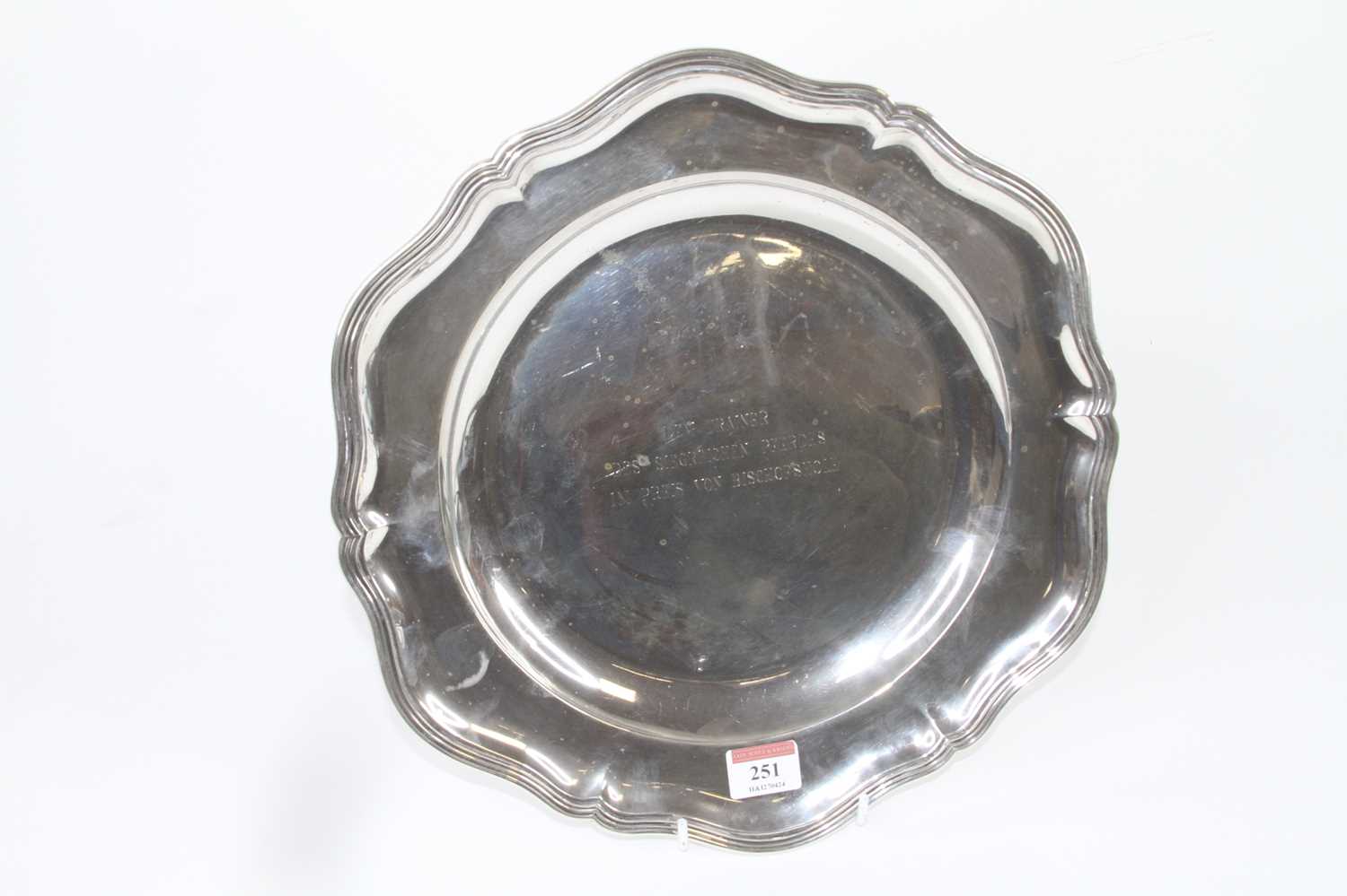 A German silver dish having a shaped reeded rim and sunken well with engraved inscription, maker
