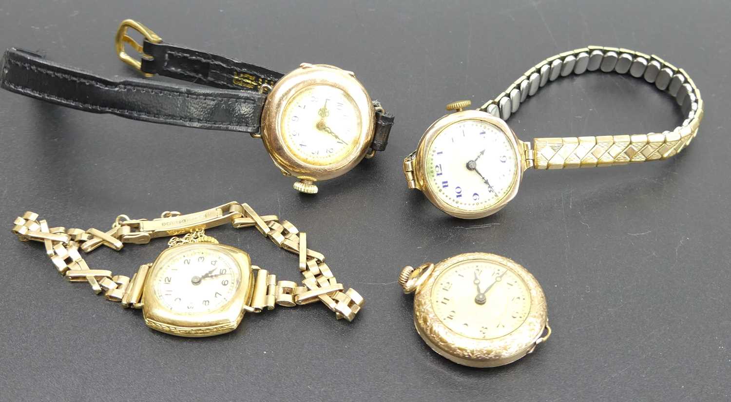 A lady's vintage 18ct gold cased manual wind wristwatch, on 9ct gold bracelet, with safety chain,